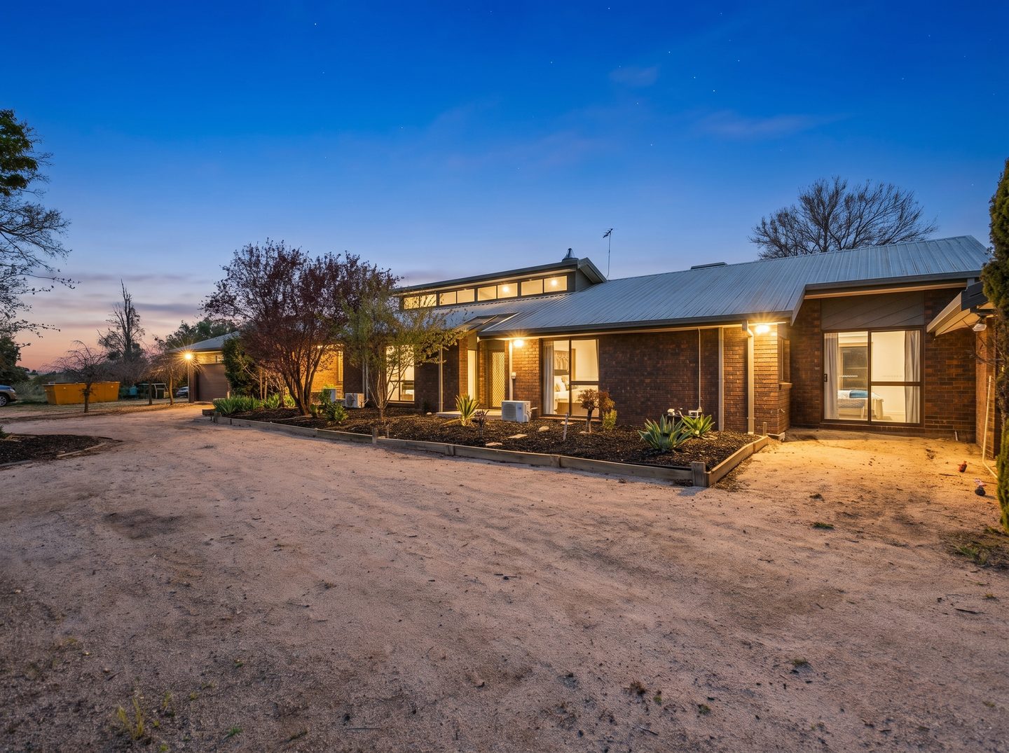 Front courtyard and the home at dusk