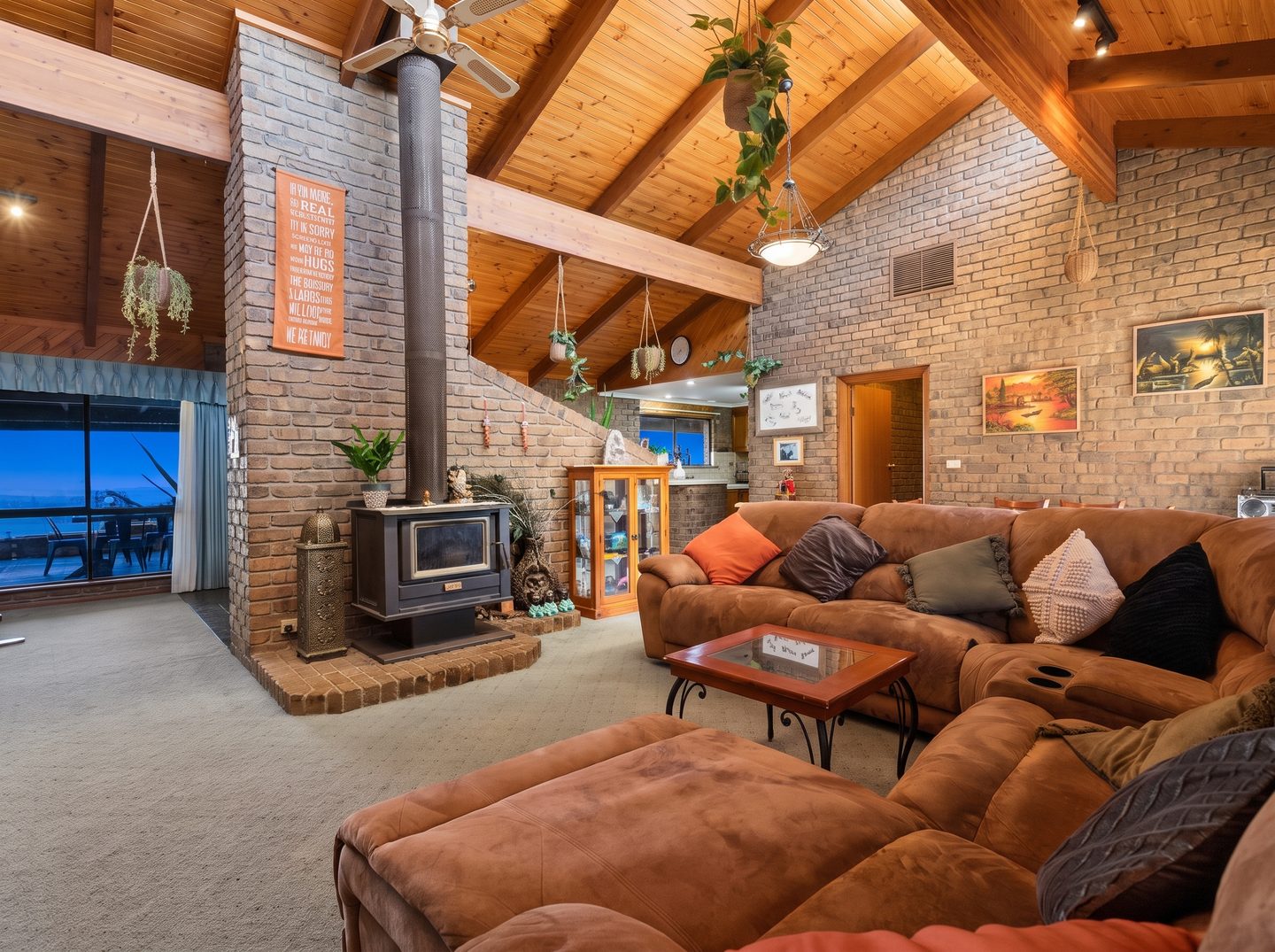 Combustion heater and pitched timber ceiling in the family room