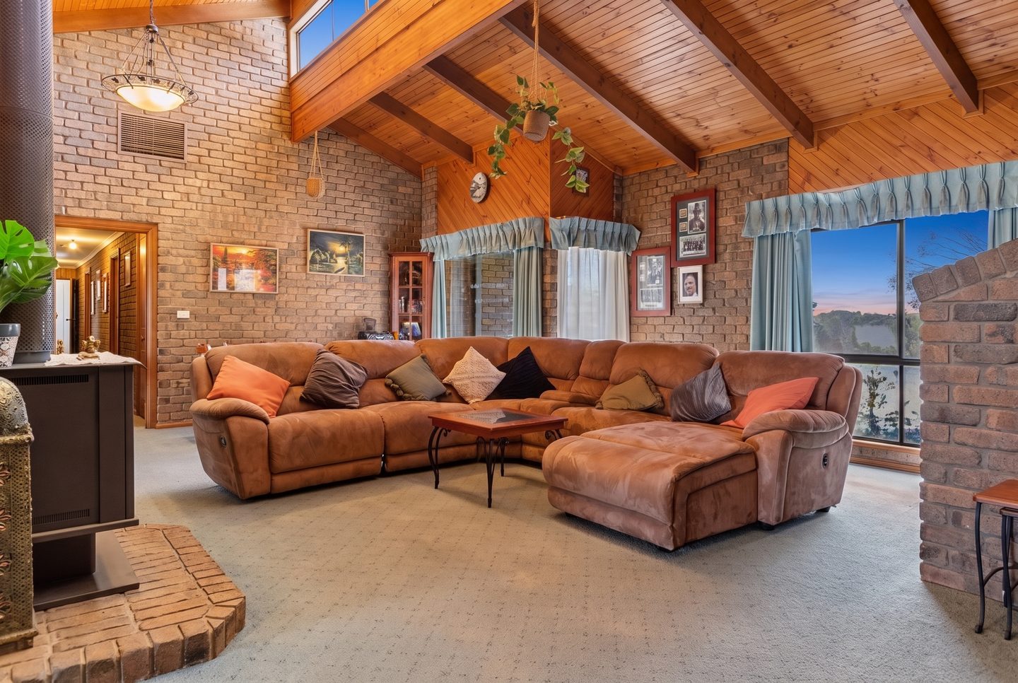 The family room beneath the timber ceiling