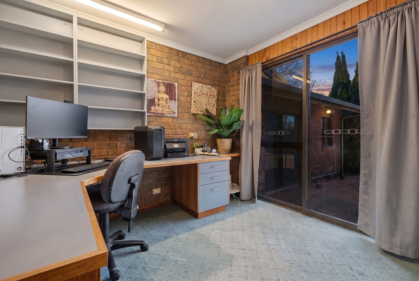 Study with a built-in desk and shelving