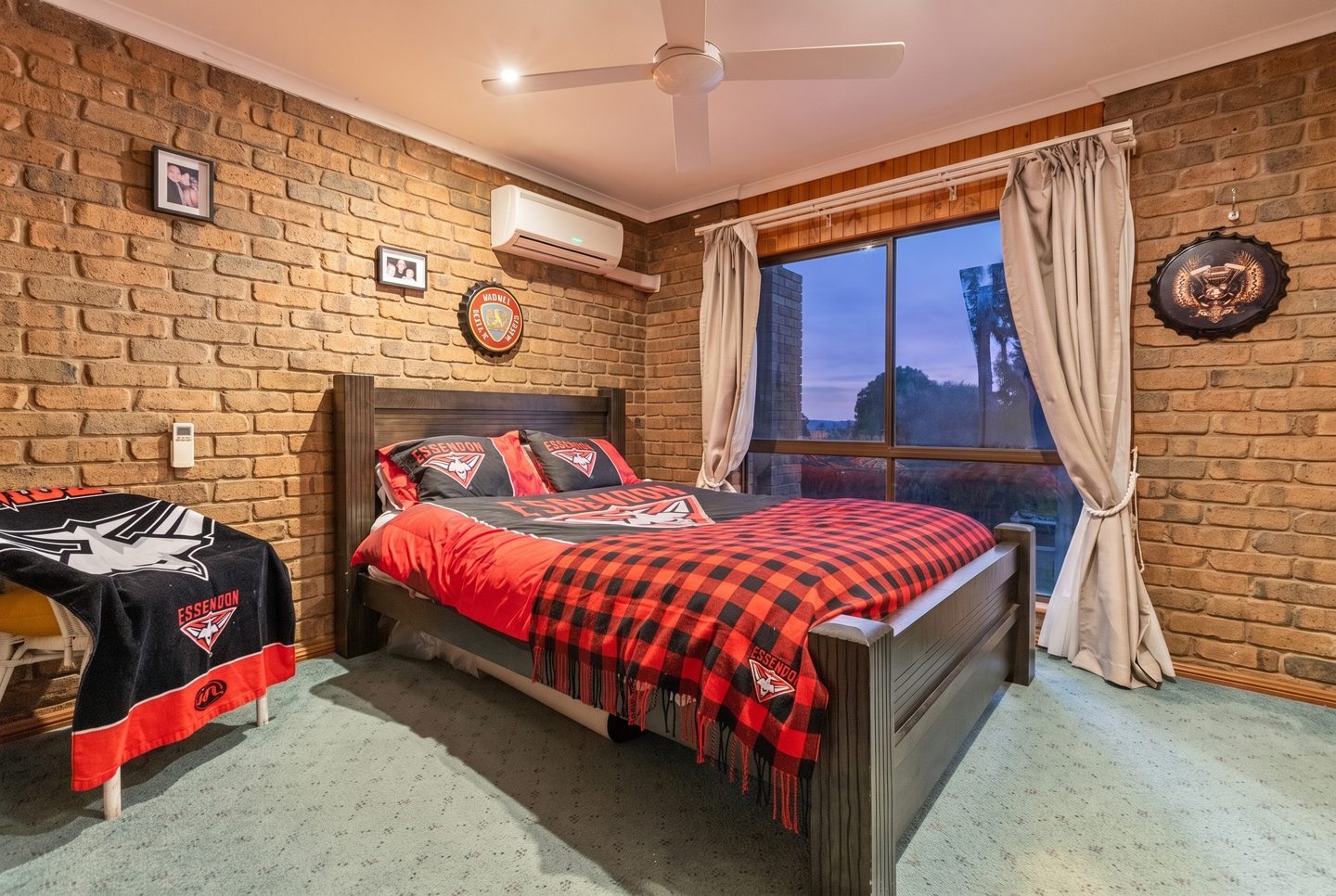 Bedroom with exposed brick walls