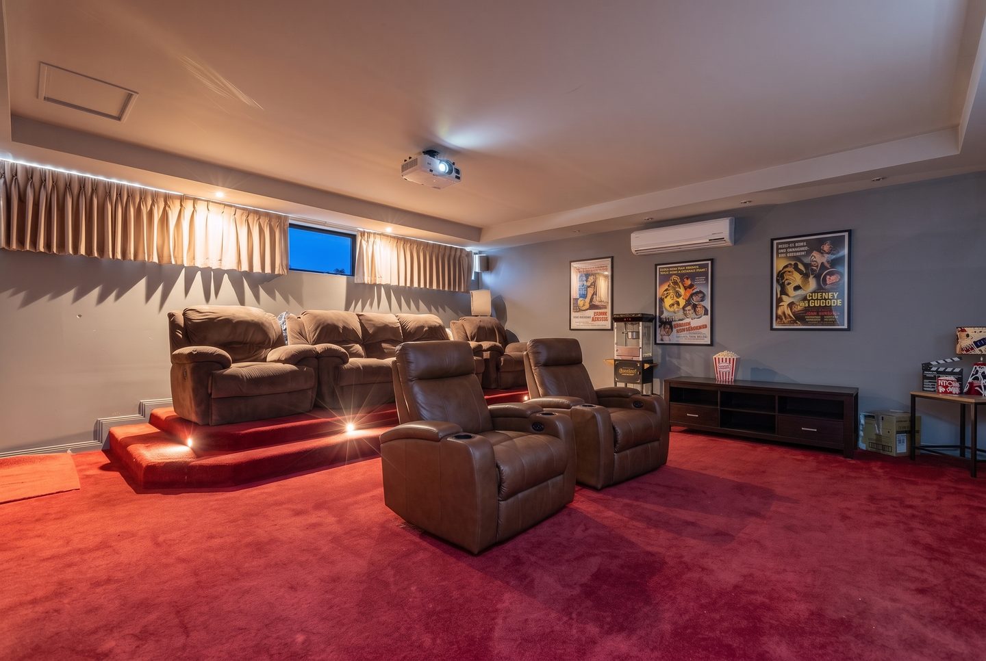 Separate theatre room with raised rear platform
